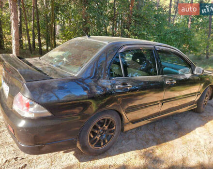 Чорний Міцубісі Lancer, об'ємом двигуна 2 л та пробігом 290 тис. км за 3300 $, фото 4 на Automoto.ua