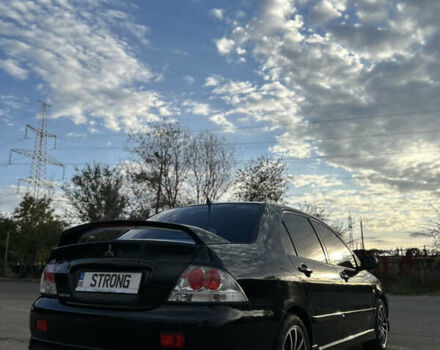 Чорний Міцубісі Lancer, об'ємом двигуна 2 л та пробігом 280 тис. км за 4600 $, фото 26 на Automoto.ua