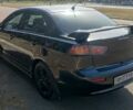 Чорний Міцубісі Lancer, об'ємом двигуна 2 л та пробігом 312 тис. км за 4200 $, фото 1 на Automoto.ua