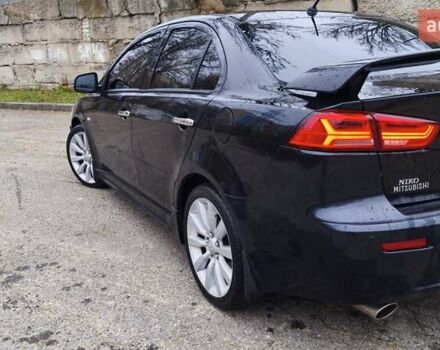Черный Мицубиси Лансер, объемом двигателя 2 л и пробегом 230 тыс. км за 7100 $, фото 8 на Automoto.ua