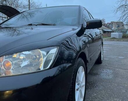 Черный Мицубиси Лансер, объемом двигателя 1.6 л и пробегом 249 тыс. км за 5000 $, фото 6 на Automoto.ua