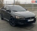 Черный Мицубиси Лансер, объемом двигателя 2 л и пробегом 259 тыс. км за 7500 $, фото 1 на Automoto.ua