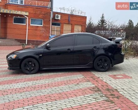 Черный Мицубиси Лансер, объемом двигателя 2 л и пробегом 217 тыс. км за 5500 $, фото 4 на Automoto.ua