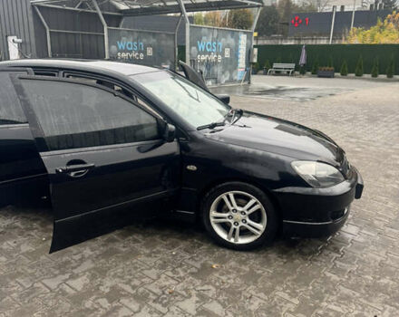 Чорний Міцубісі Lancer, об'ємом двигуна 2 л та пробігом 210 тис. км за 5500 $, фото 17 на Automoto.ua