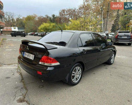 Чорний Міцубісі Lancer, об'ємом двигуна 1.58 л та пробігом 173 тис. км за 4700 $, фото 4 на Automoto.ua