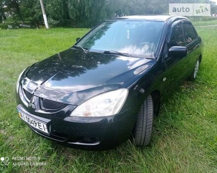 Чорний Міцубісі Lancer, об'ємом двигуна 1.58 л та пробігом 400 тис. км за 3700 $, фото 16 на Automoto.ua