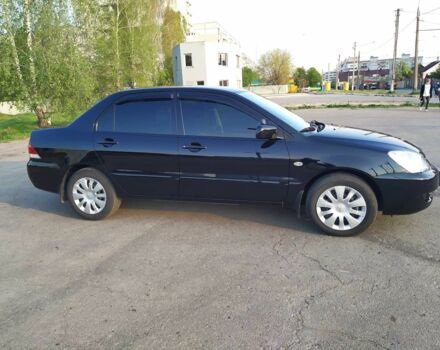 Черный Мицубиси Лансер, объемом двигателя 1.6 л и пробегом 32 тыс. км за 9000 $, фото 10 на Automoto.ua