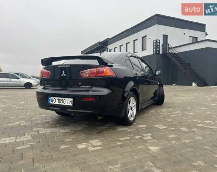 Черный Мицубиси Лансер, объемом двигателя 2 л и пробегом 259 тыс. км за 6500 $, фото 1 на Automoto.ua