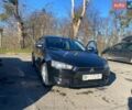 Черный Мицубиси Лансер, объемом двигателя 2 л и пробегом 389 тыс. км за 4800 $, фото 1 на Automoto.ua