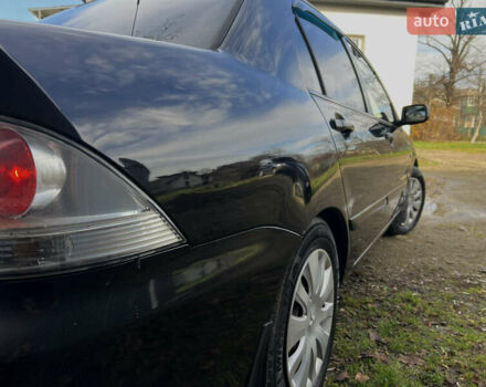 Чорний Міцубісі Lancer, об'ємом двигуна 1.58 л та пробігом 185 тис. км за 3750 $, фото 5 на Automoto.ua