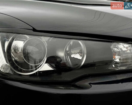 Черный Мицубиси Лансер, объемом двигателя 2 л и пробегом 215 тыс. км за 5500 $, фото 11 на Automoto.ua