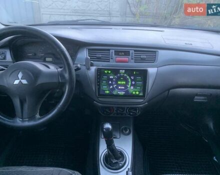 Чорний Міцубісі Lancer, об'ємом двигуна 1.58 л та пробігом 237 тис. км за 4300 $, фото 8 на Automoto.ua