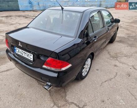 Чорний Міцубісі Lancer, об'ємом двигуна 1.6 л та пробігом 273 тис. км за 3999 $, фото 8 на Automoto.ua