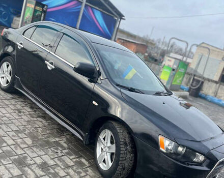 Чорний Міцубісі Lancer, об'ємом двигуна 2 л та пробігом 188 тис. км за 6600 $, фото 2 на Automoto.ua