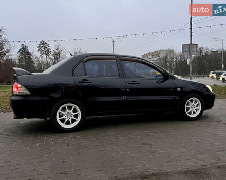 Чорний Міцубісі Lancer, об'ємом двигуна 1.6 л та пробігом 303 тис. км за 4350 $, фото 11 на Automoto.ua
