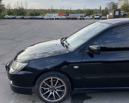 Чорний Міцубісі Lancer, об'ємом двигуна 2 л та пробігом 280 тис. км за 4600 $, фото 11 на Automoto.ua