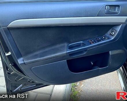 Черный Мицубиси Лансер, объемом двигателя 2 л и пробегом 216 тыс. км за 7500 $, фото 5 на Automoto.ua