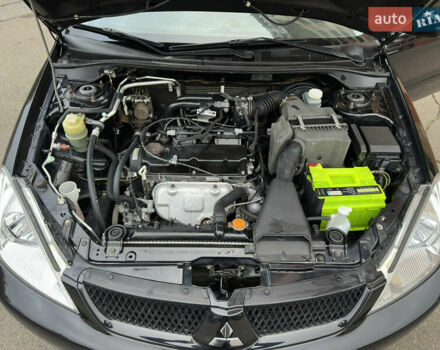 Чорний Міцубісі Lancer, об'ємом двигуна 1.58 л та пробігом 173 тис. км за 4700 $, фото 19 на Automoto.ua