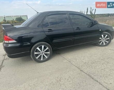 Чорний Міцубісі Lancer, об'ємом двигуна 1.6 л та пробігом 310 тис. км за 5100 $, фото 15 на Automoto.ua