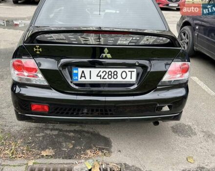 Черный Мицубиси Лансер, объемом двигателя 2 л и пробегом 219 тыс. км за 4400 $, фото 3 на Automoto.ua