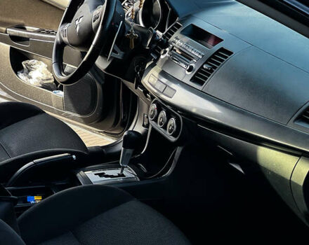 Черный Мицубиси Лансер, объемом двигателя 2 л и пробегом 333 тыс. км за 7300 $, фото 1 на Automoto.ua