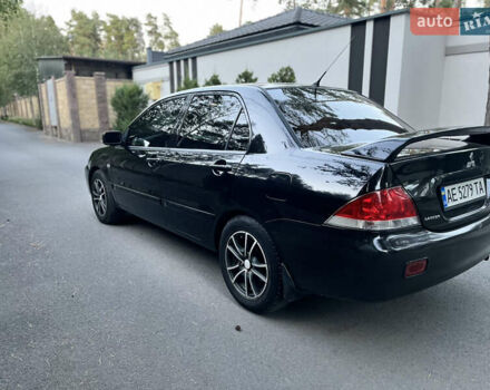 Черный Мицубиси Лансер, объемом двигателя 1.58 л и пробегом 278 тыс. км за 4800 $, фото 3 на Automoto.ua