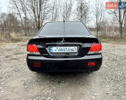 Черный Мицубиси Лансер, объемом двигателя 1.6 л и пробегом 216 тыс. км за 4990 $, фото 3 на Automoto.ua