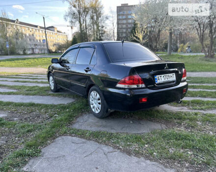 Чорний Міцубісі Lancer, об'ємом двигуна 1.58 л та пробігом 161 тис. км за 5300 $, фото 10 на Automoto.ua