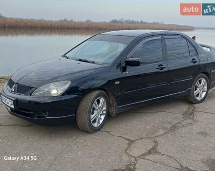 Черный Мицубиси Лансер, объемом двигателя 2 л и пробегом 286 тыс. км за 4000 $, фото 1 на Automoto.ua