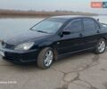 Черный Мицубиси Лансер, объемом двигателя 2 л и пробегом 286 тыс. км за 4000 $, фото 1 на Automoto.ua