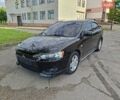 Чорний Міцубісі Lancer, об'ємом двигуна 2 л та пробігом 173 тис. км за 8800 $, фото 1 на Automoto.ua