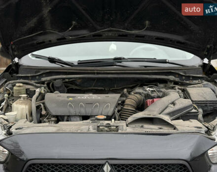 Черный Мицубиси Лансер, объемом двигателя 2 л и пробегом 215 тыс. км за 5500 $, фото 16 на Automoto.ua