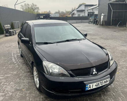 Чорний Міцубісі Lancer, об'ємом двигуна 2 л та пробігом 210 тис. км за 5500 $, фото 51 на Automoto.ua