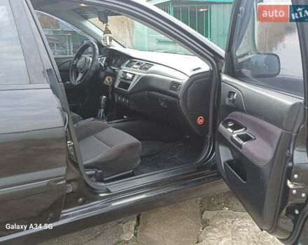 Черный Мицубиси Лансер, объемом двигателя 2 л и пробегом 286 тыс. км за 4000 $, фото 11 на Automoto.ua