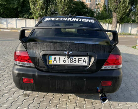 Черный Мицубиси Лансер, объемом двигателя 1.6 л и пробегом 259 тыс. км за 4500 $, фото 8 на Automoto.ua