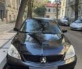 Черный Мицубиси Лансер, объемом двигателя 1.6 л и пробегом 351 тыс. км за 3216 $, фото 1 на Automoto.ua