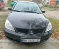 Чорний Міцубісі Lancer, об'ємом двигуна 1.58 л та пробігом 227 тис. км за 4100 $, фото 1 на Automoto.ua