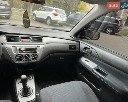 Чорний Міцубісі Lancer, об'ємом двигуна 1.58 л та пробігом 173 тис. км за 4700 $, фото 14 на Automoto.ua