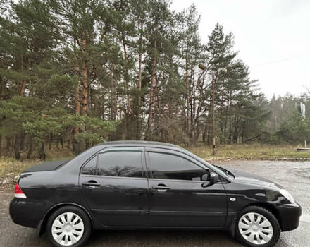 Черный Мицубиси Лансер, объемом двигателя 1.58 л и пробегом 254 тыс. км за 5000 $, фото 5 на Automoto.ua