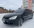 Чорний Міцубісі Lancer, об'ємом двигуна 1.58 л та пробігом 199 тис. км за 4400 $, фото 8 на Automoto.ua