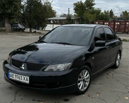 Чорний Міцубісі Lancer, об'ємом двигуна 2 л та пробігом 143 тис. км за 5400 $, фото 1 на Automoto.ua