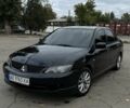 Чорний Міцубісі Lancer, об'ємом двигуна 2 л та пробігом 143 тис. км за 5400 $, фото 1 на Automoto.ua