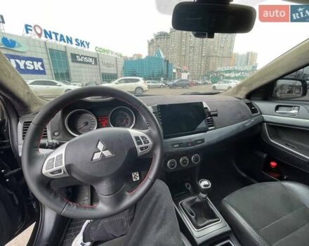Черный Мицубиси Лансер, объемом двигателя 2 л и пробегом 246 тыс. км за 7500 $, фото 14 на Automoto.ua