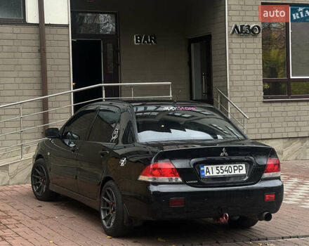 Черный Мицубиси Лансер, объемом двигателя 1.6 л и пробегом 211 тыс. км за 5700 $, фото 9 на Automoto.ua