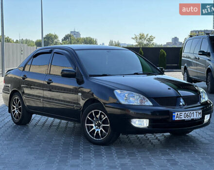Чорний Міцубісі Lancer, об'ємом двигуна 1.58 л та пробігом 191 тис. км за 4899 $, фото 9 на Automoto.ua