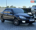 Чорний Міцубісі Lancer, об'ємом двигуна 1.58 л та пробігом 191 тис. км за 4899 $, фото 9 на Automoto.ua