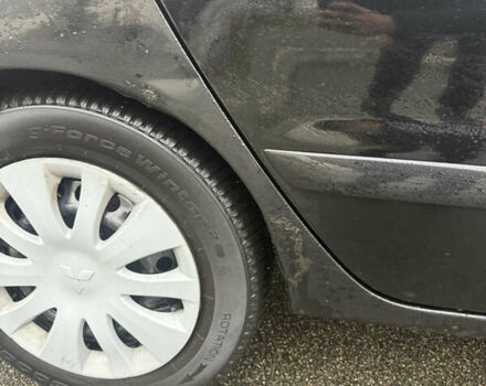 Чорний Міцубісі Lancer, об'ємом двигуна 1.58 л та пробігом 256 тис. км за 3700 $, фото 39 на Automoto.ua