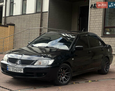 Черный Мицубиси Лансер, объемом двигателя 1.6 л и пробегом 211 тыс. км за 5700 $, фото 4 на Automoto.ua