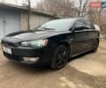 Чорний Міцубісі Lancer, об'ємом двигуна 2 л та пробігом 216 тис. км за 6200 $, фото 1 на Automoto.ua