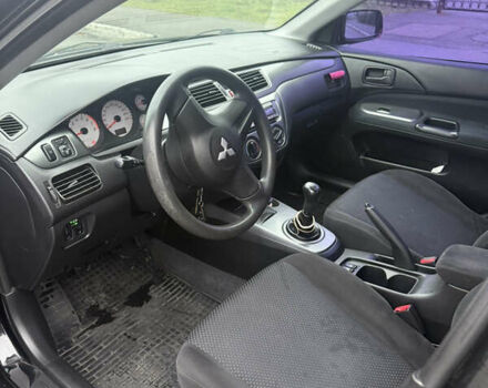 Чорний Міцубісі Lancer, об'ємом двигуна 1.58 л та пробігом 256 тис. км за 3700 $, фото 12 на Automoto.ua